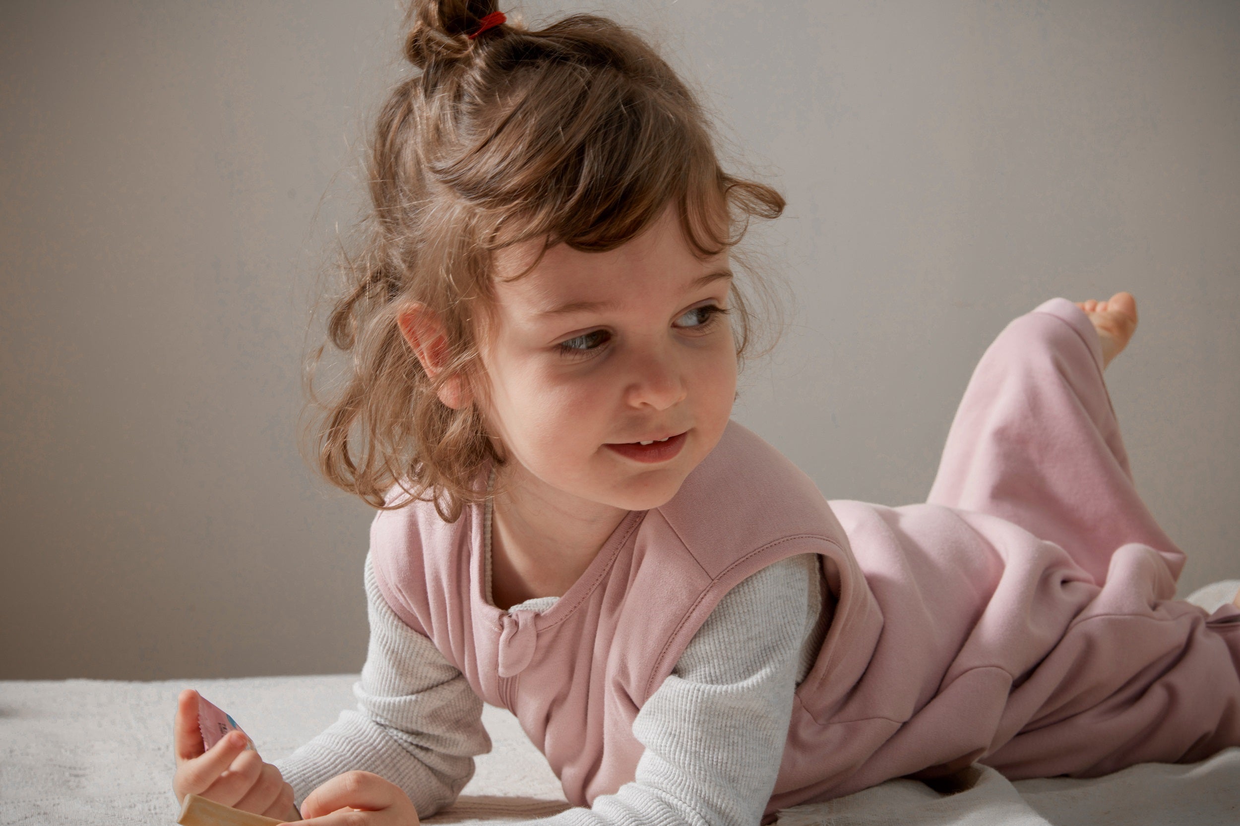 What should a baby wear to sleep under a sleep sack?