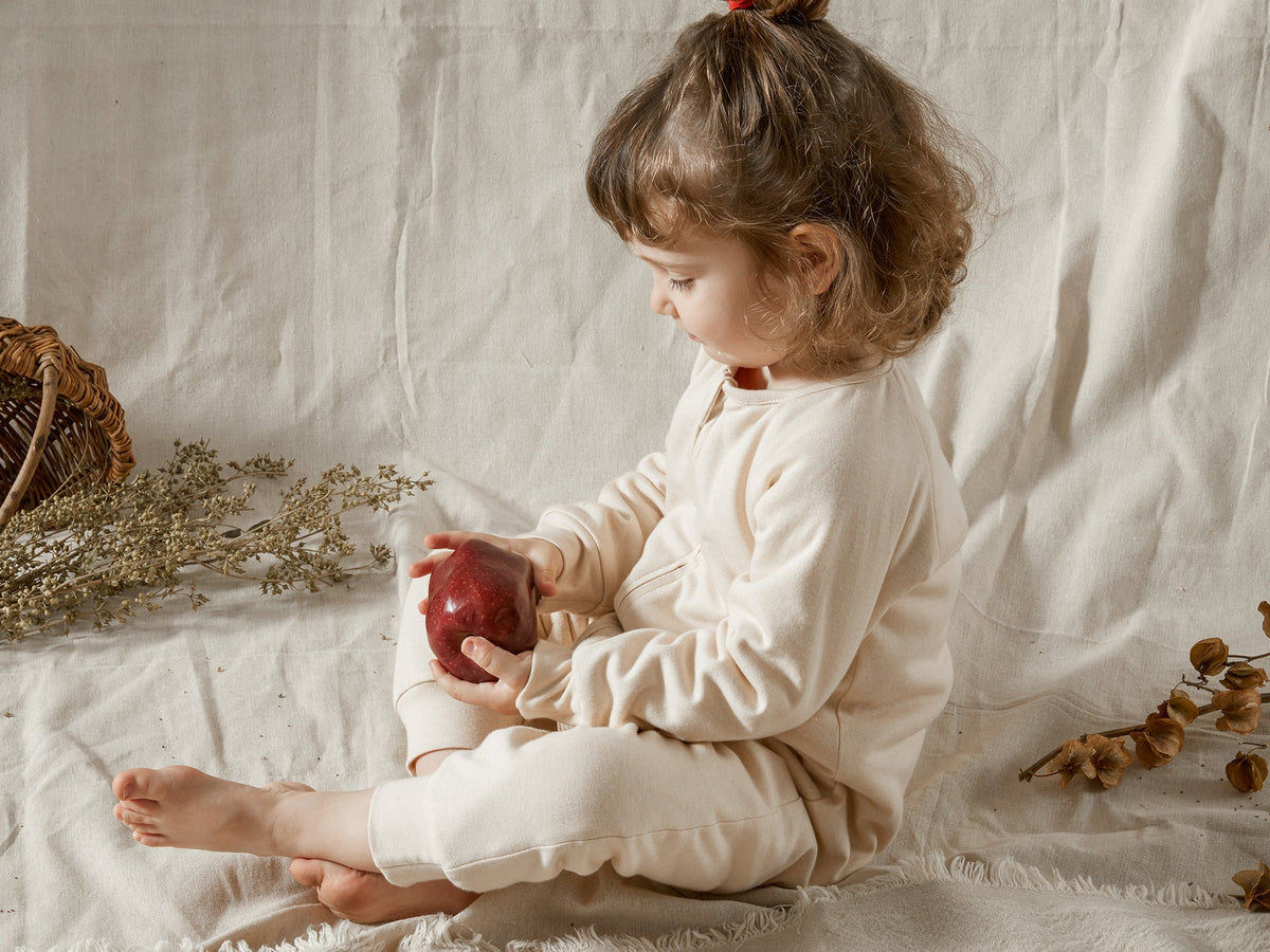 How should a sleep sack fit?