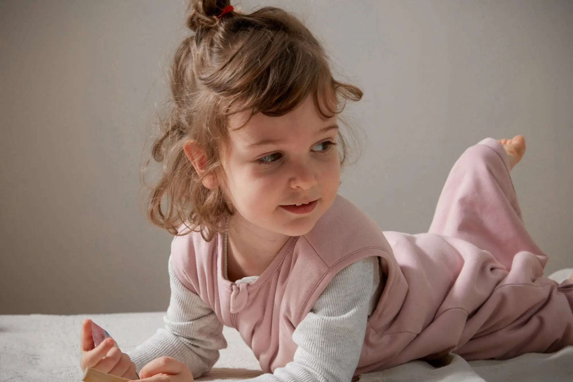 What should a baby wear to sleep under a sleep sack?