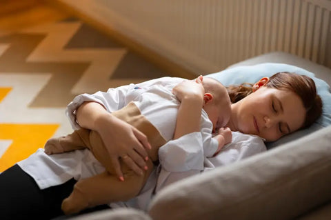 A Baby Sleeping On His Mother's Belly