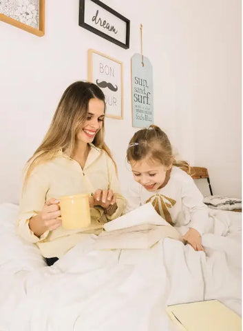 A Mom Reads Books With Her Daughter