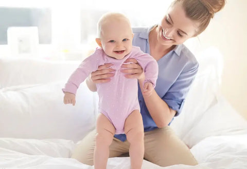 A Smiling Baby And Mom