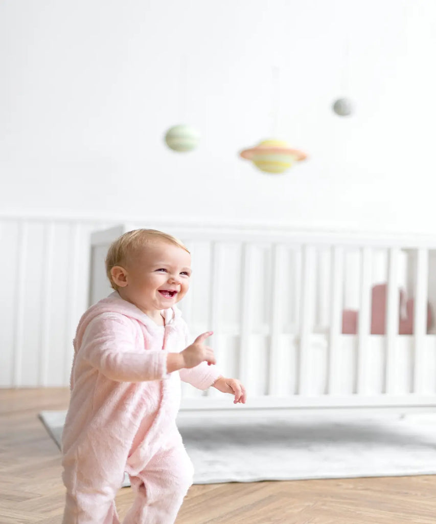 A cute baby girl smiling her nursery