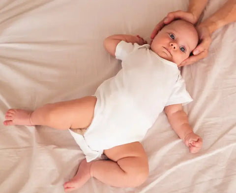 Baby Boy Stretching In Bed