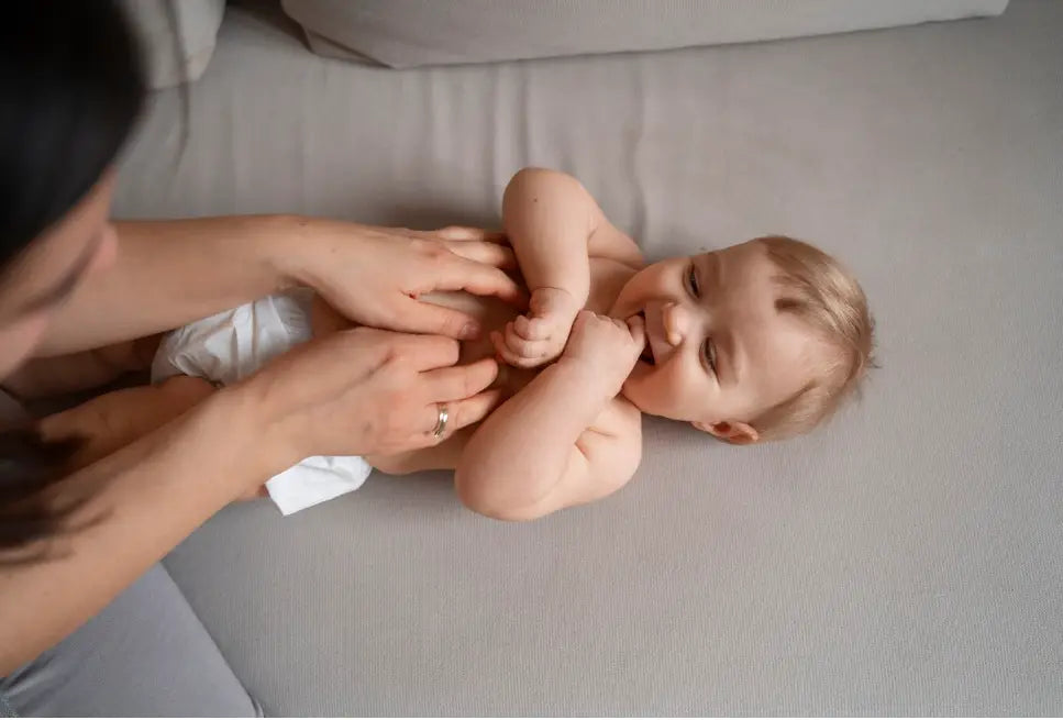 Mother Tickling Baby