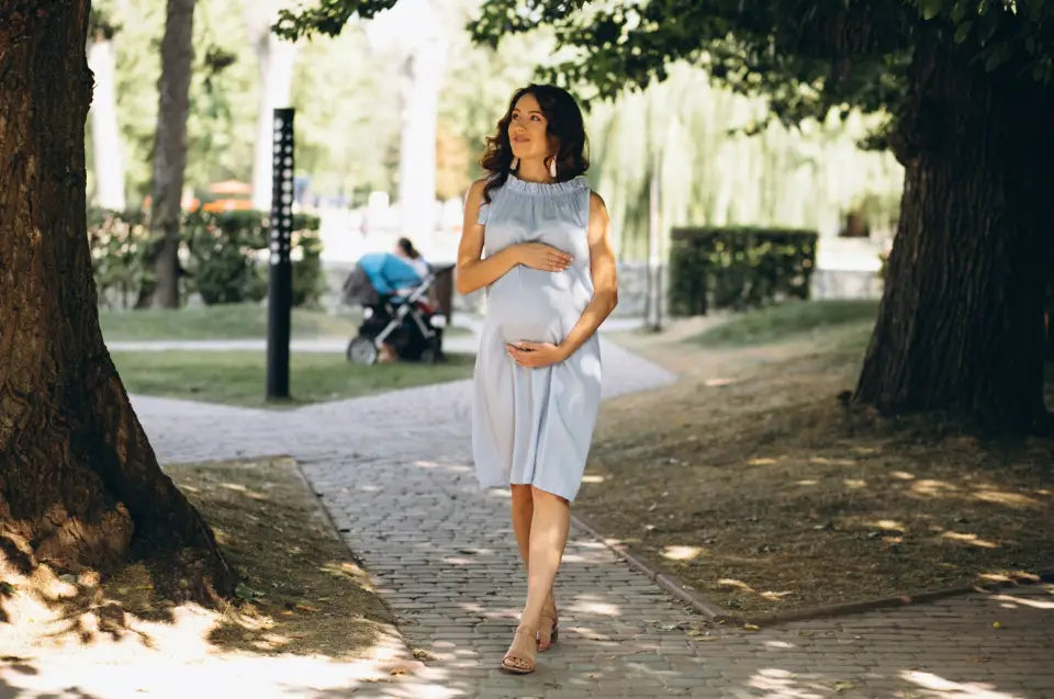 Pregnant Mom Walking In Park