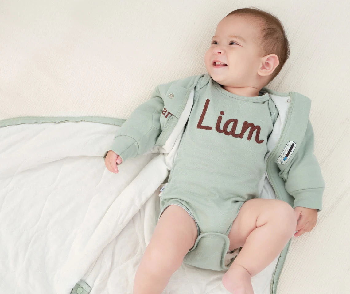 baby wearing a bodysuit layer in Kaiyababy sleep sack
