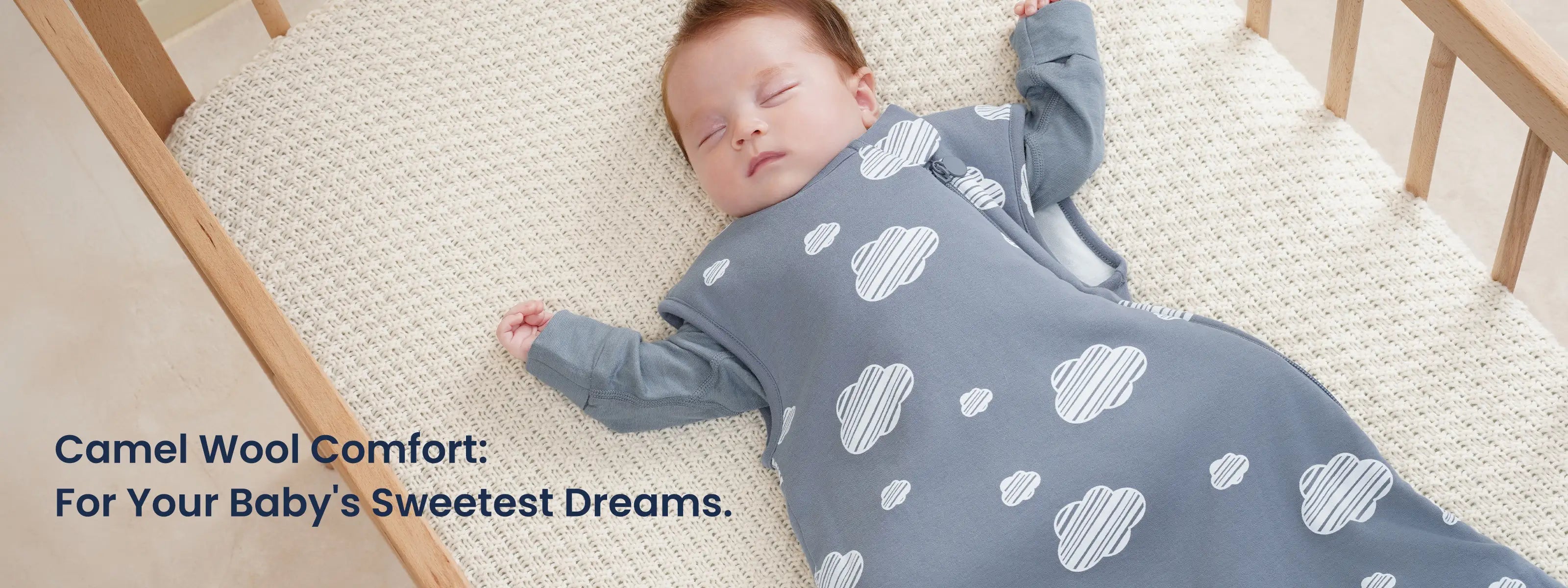baby sleeping in a crib wearing a  camel wool sleep sack
